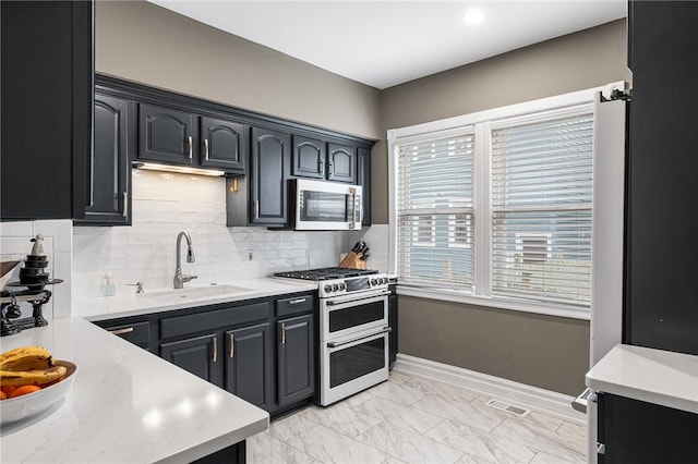 kitchen featuring a sink, stainless steel appliances, plenty of natural light, and visible vents