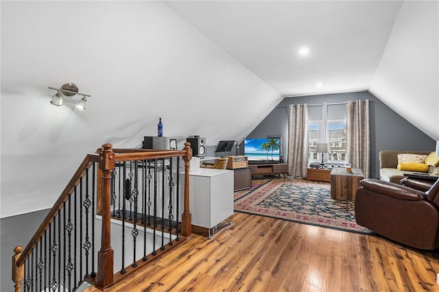 bonus room featuring lofted ceiling and wood finished floors