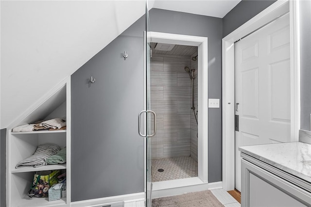 full bath with vanity and a shower stall