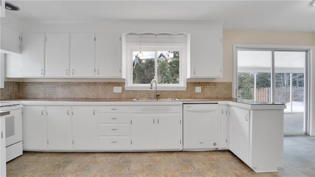 kitchen featuring a sink, white appliances, white cabinetry, and light countertops