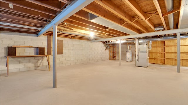 unfinished below grade area with gas water heater and heating unit