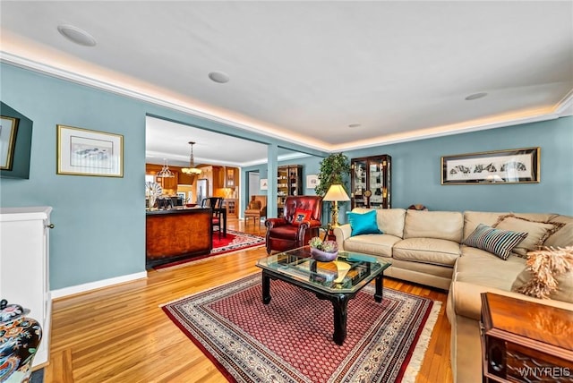 living room with light wood-style floors and baseboards