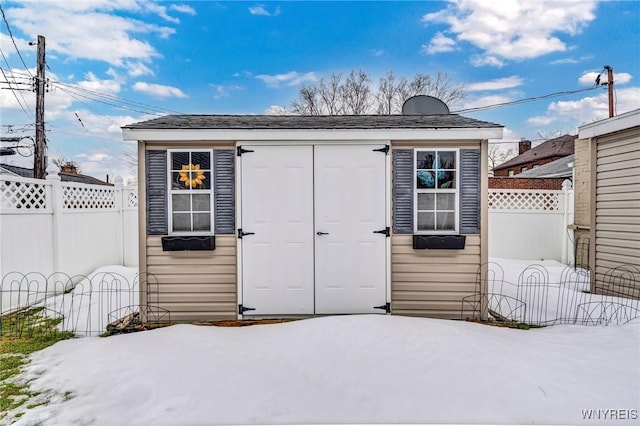 view of shed with a fenced backyard