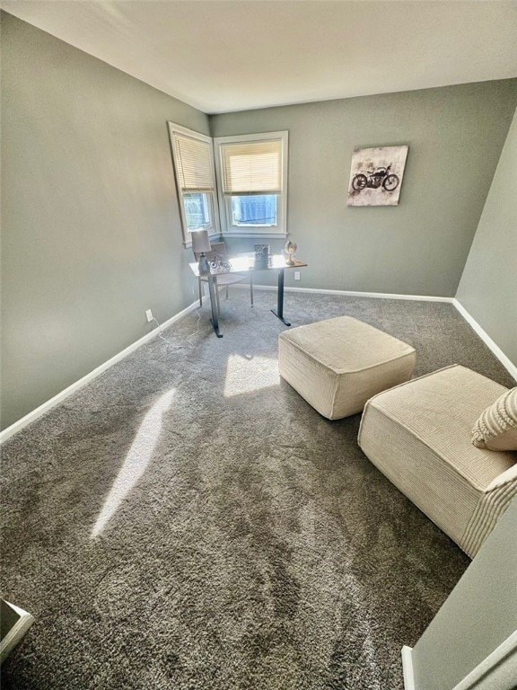 interior space with carpet flooring and baseboards