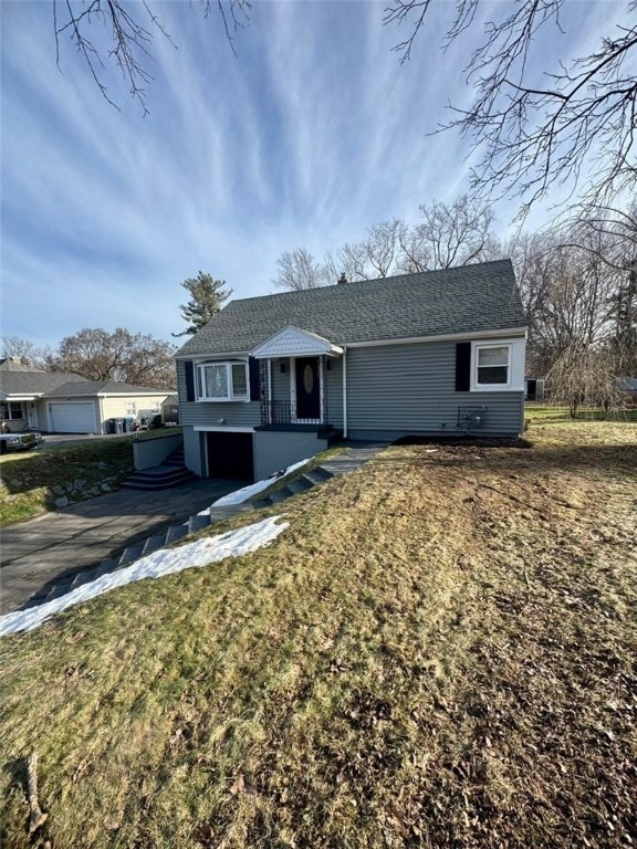 single story home featuring aphalt driveway