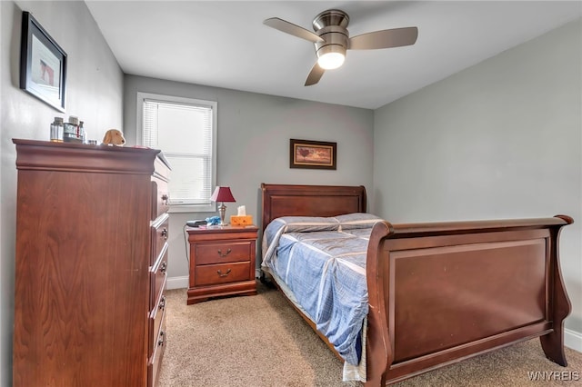 bedroom featuring ceiling fan, baseboards, and carpet floors