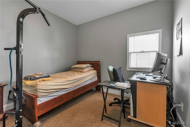 carpeted bedroom featuring baseboards