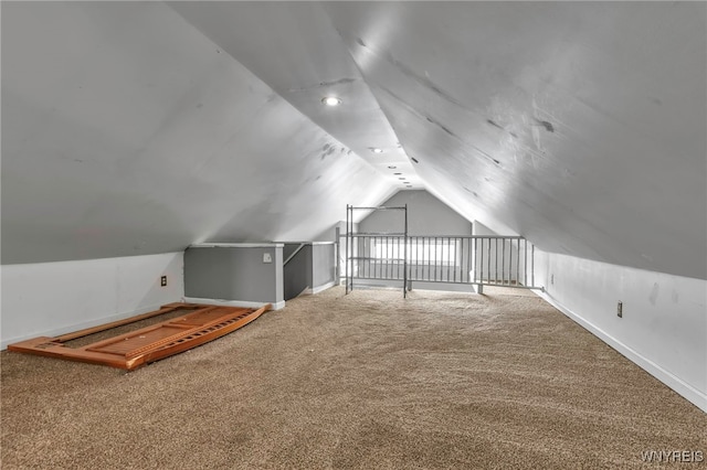 additional living space with baseboards, carpet floors, and lofted ceiling