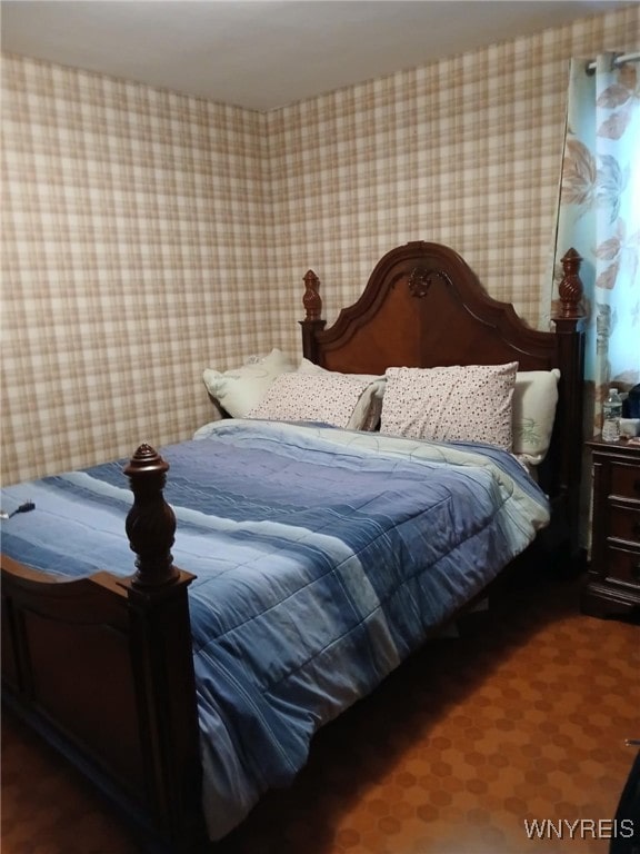 bedroom with wallpapered walls