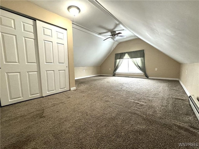 bonus room featuring ceiling fan, baseboards, vaulted ceiling, carpet floors, and a baseboard radiator