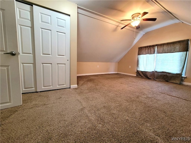 bonus room with vaulted ceiling, carpet, and baseboards