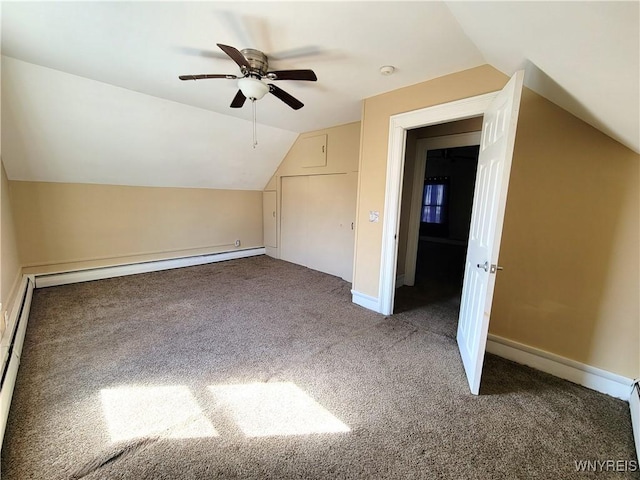 additional living space featuring baseboard heating, carpet flooring, baseboards, and lofted ceiling