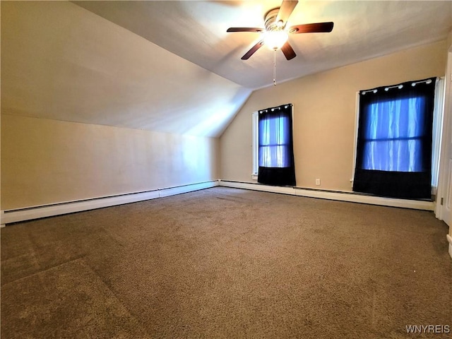 additional living space with a baseboard radiator, carpet floors, lofted ceiling, and a ceiling fan