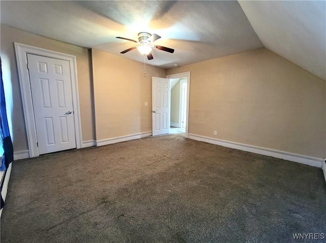 interior space featuring baseboards, lofted ceiling, carpet, and a ceiling fan