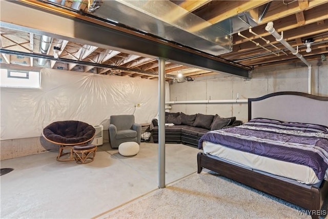 bedroom featuring concrete flooring