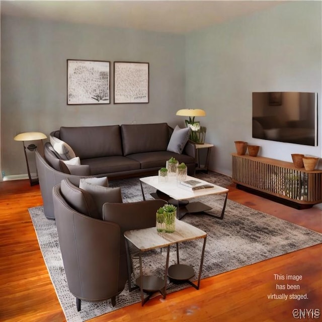 living room with wood finished floors and baseboards