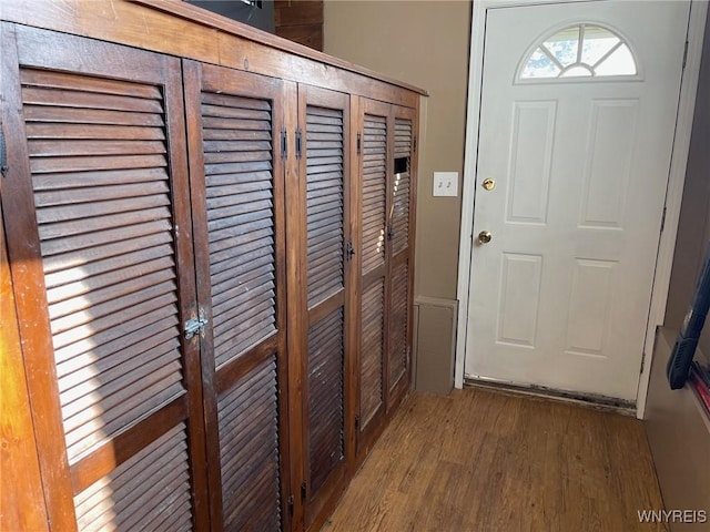 doorway to outside with wood finished floors