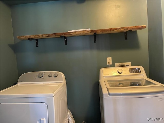 washroom with separate washer and dryer and laundry area