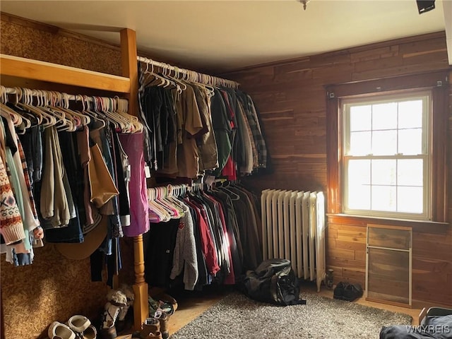 spacious closet featuring radiator