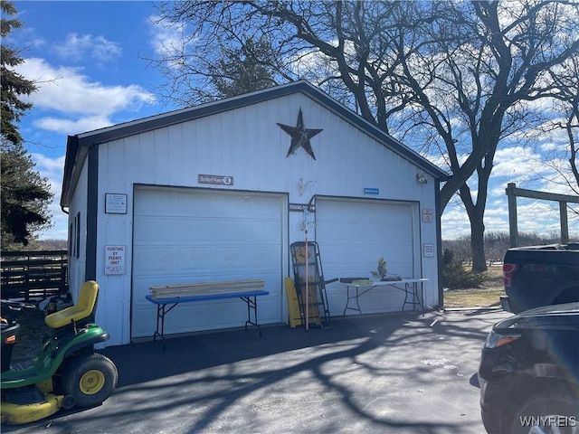 detached garage with fence