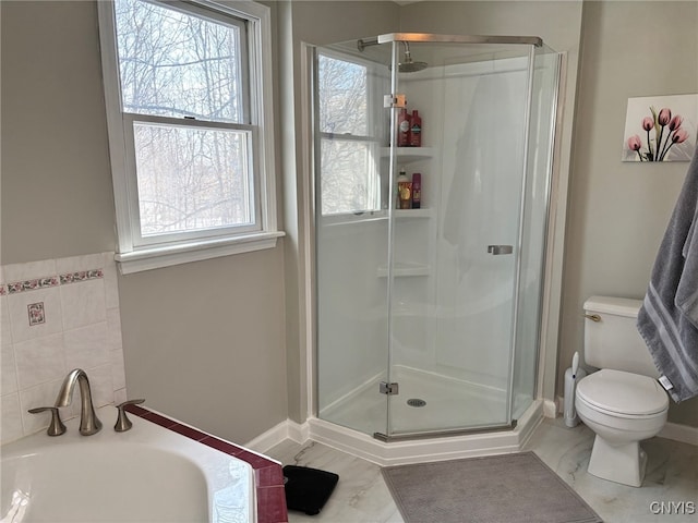 full bathroom featuring a shower stall, toilet, a bath, and a sink