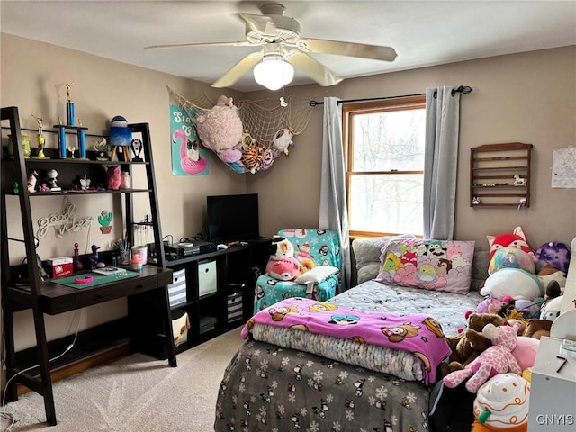 interior space with a ceiling fan and carpet floors