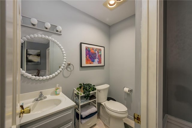 half bath with vanity and toilet