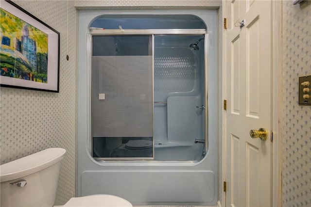 bathroom featuring toilet and wallpapered walls