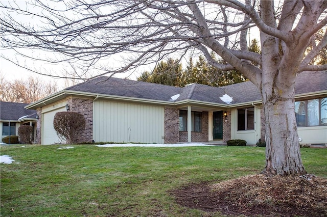 single story home featuring a front yard, brick siding, roof with shingles, and an attached garage