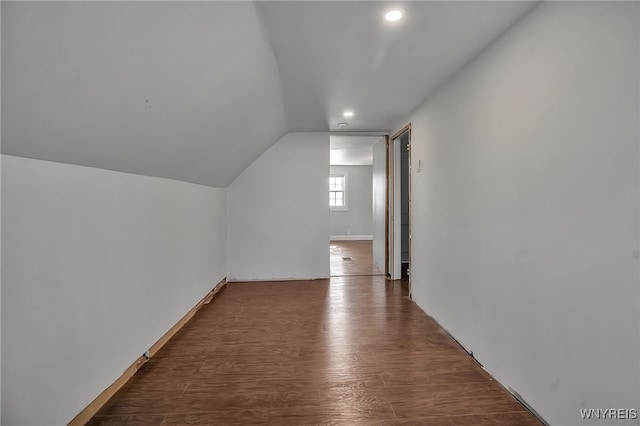 additional living space featuring recessed lighting, wood finished floors, and vaulted ceiling