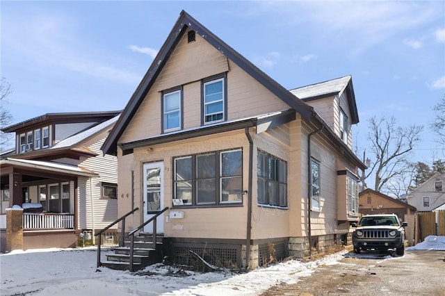 bungalow-style home with entry steps