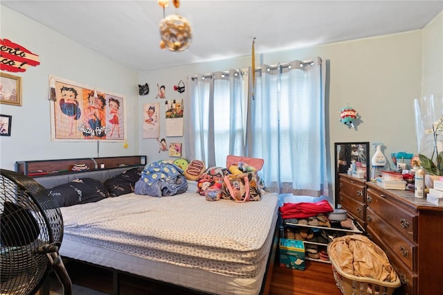 bedroom with wood finished floors