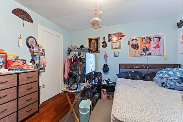 bedroom featuring dark wood-style floors