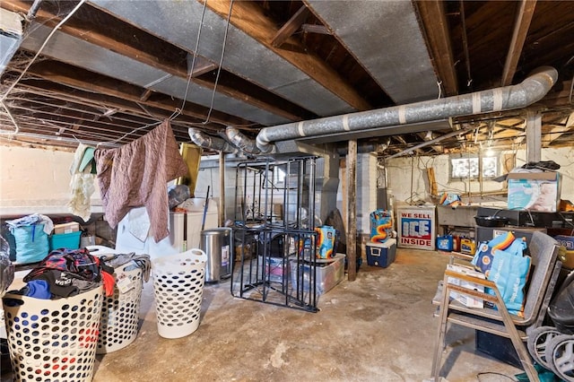 unfinished below grade area with washer / dryer