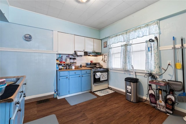kitchen with blue cabinetry, ventilation hood, gas range, wood counters, and dark wood-style flooring