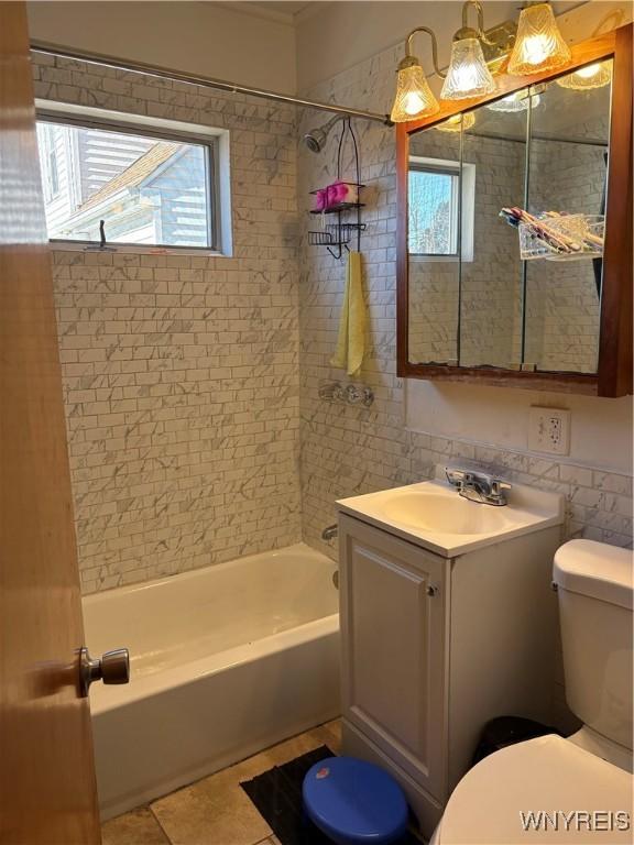 bathroom featuring vanity, toilet, and shower / bathing tub combination