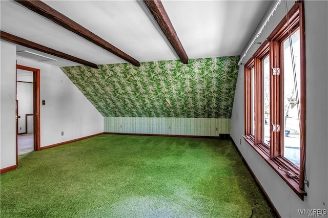 bonus room with a wealth of natural light, beamed ceiling, baseboards, and wallpapered walls