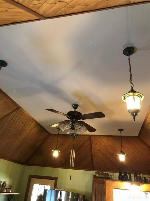 room details featuring wooden walls and wooden ceiling