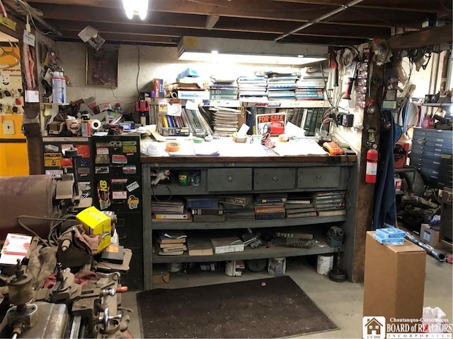 unfinished basement with a workshop area