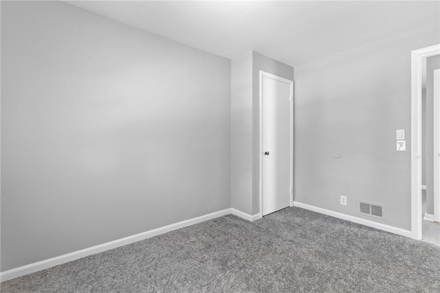 unfurnished bedroom featuring a closet, visible vents, carpet flooring, and baseboards