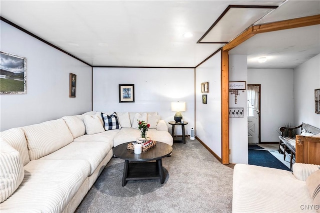 carpeted living area featuring baseboards