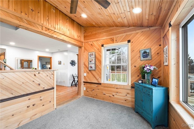 entryway with recessed lighting, carpet floors, wooden walls, lofted ceiling, and wood ceiling