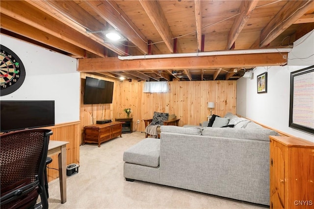 living area featuring wood walls and carpet floors