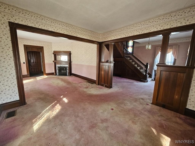 bonus room featuring stairway, carpet, visible vents, wallpapered walls, and a fireplace