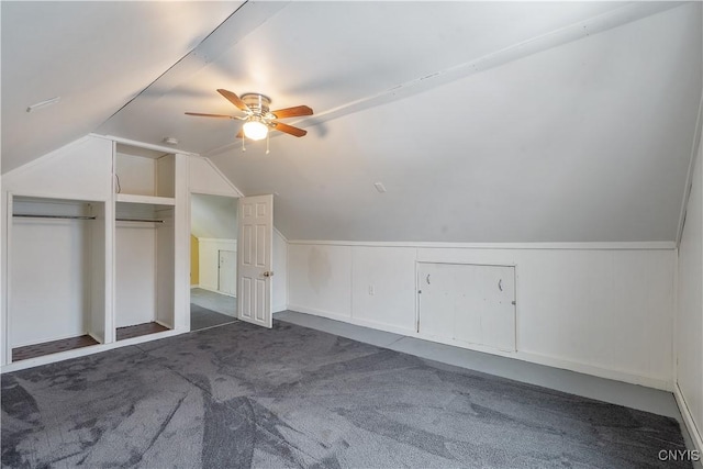 additional living space featuring a ceiling fan, lofted ceiling, and carpet