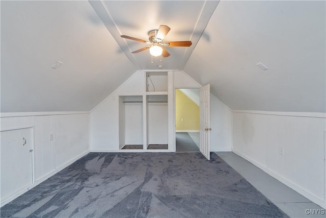 additional living space featuring carpet flooring, ceiling fan, and lofted ceiling