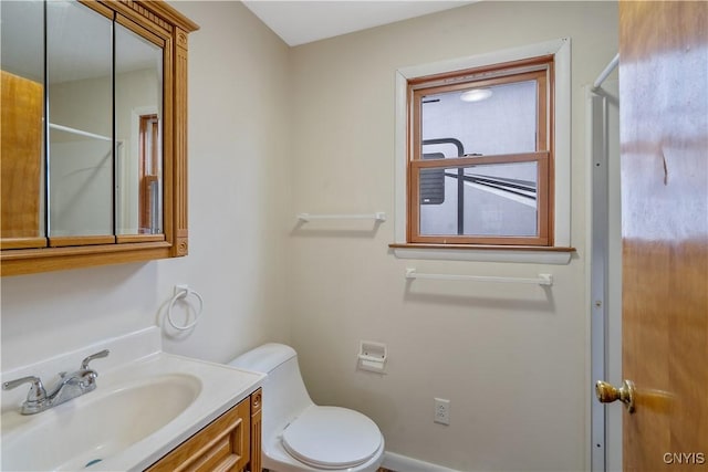 bathroom with vanity and toilet