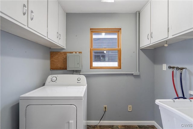 laundry area featuring washer / clothes dryer, cabinet space, baseboards, and a sink