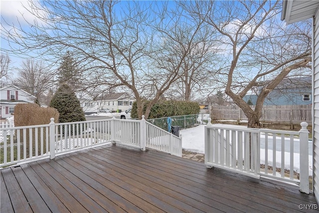 deck with a residential view and fence