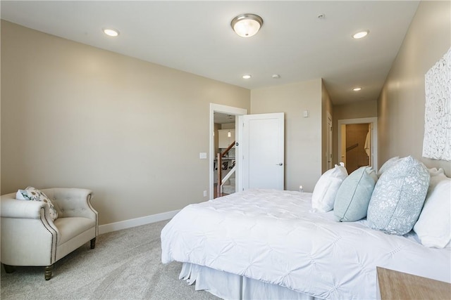 bedroom with light carpet, recessed lighting, and baseboards